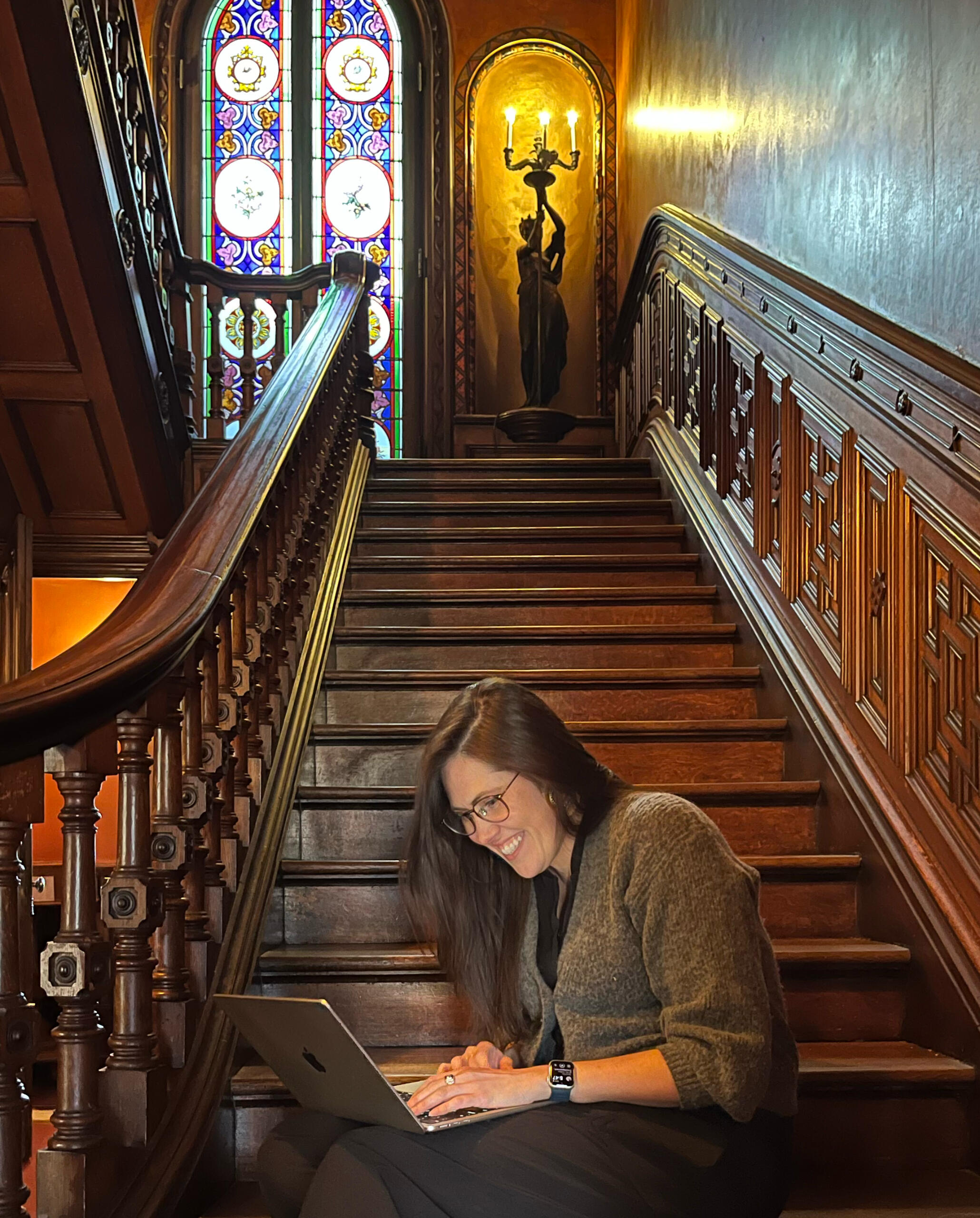 sitting on the stairs of Lippitt House Museum, answering your email!